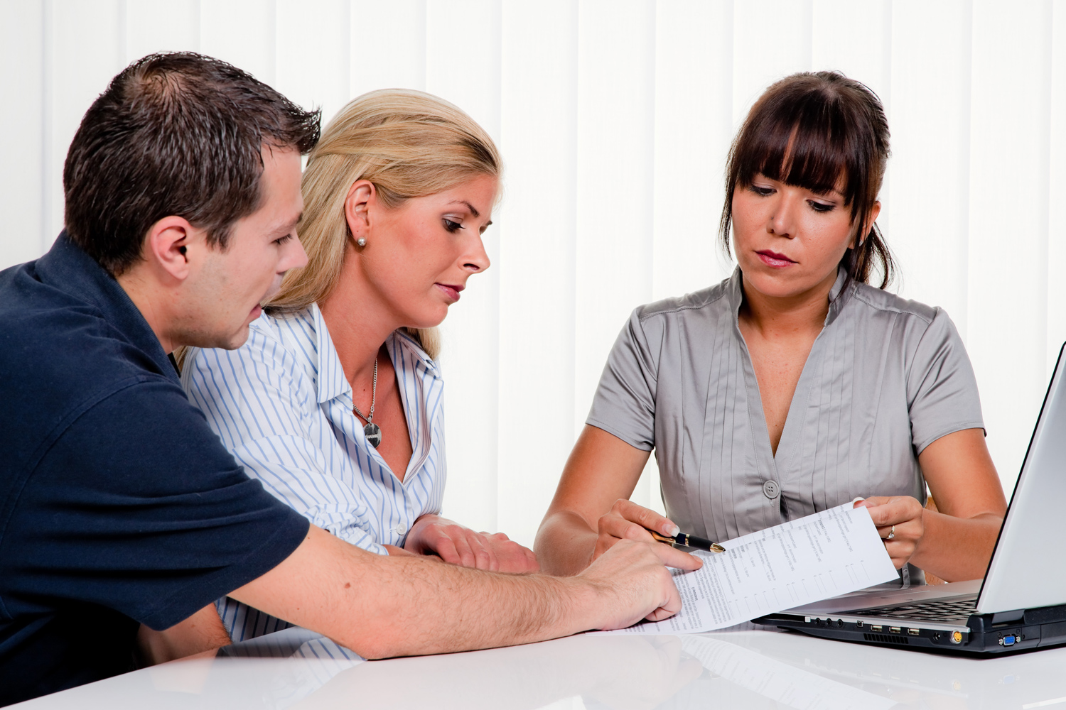 A Solicitor going over documents with a couple