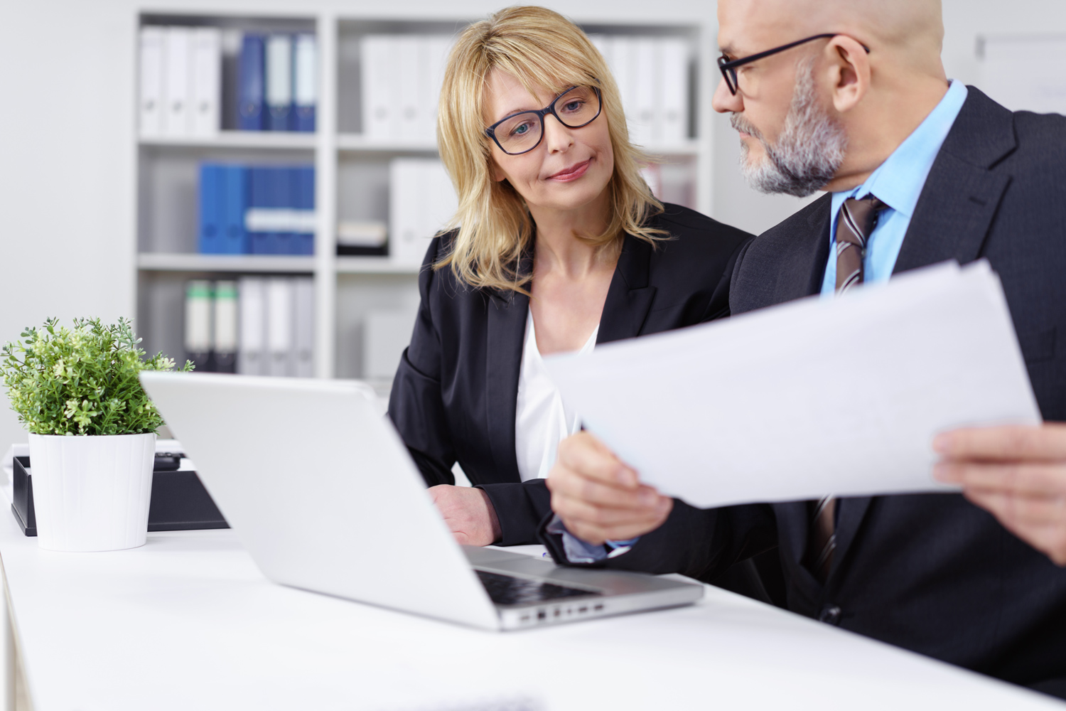 A male and female Solicitor in a meeting